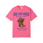 Pink t-shirt with "Her Last Rodeo" and cowboy boots graphic.