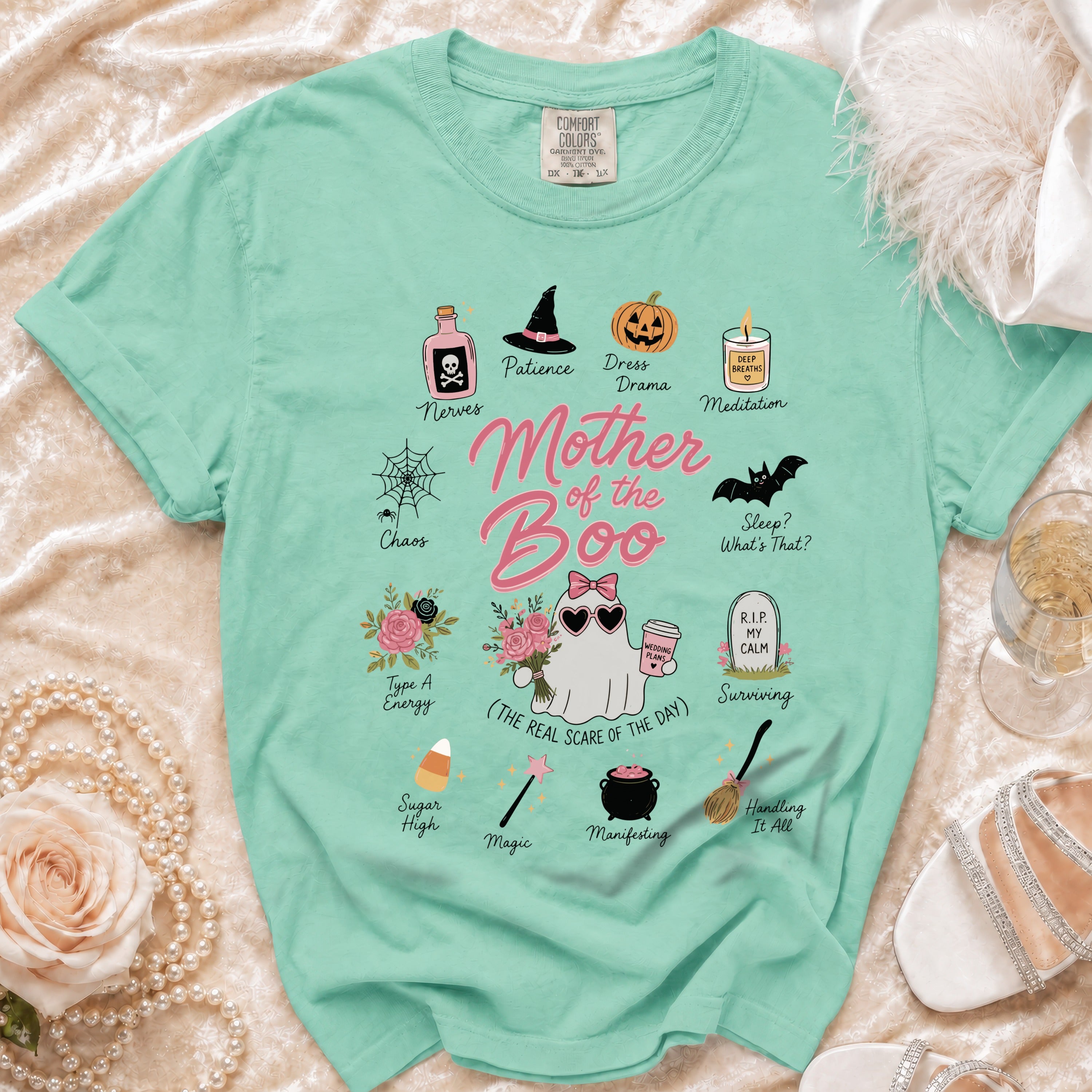 Mint green t-shirt with "Mother of the Boo" and Halloween-themed icons.