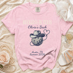 Pink t-shirt with "Reckless in Texas Olivia's Bach Austin, TX Summer 2026" graphic.
