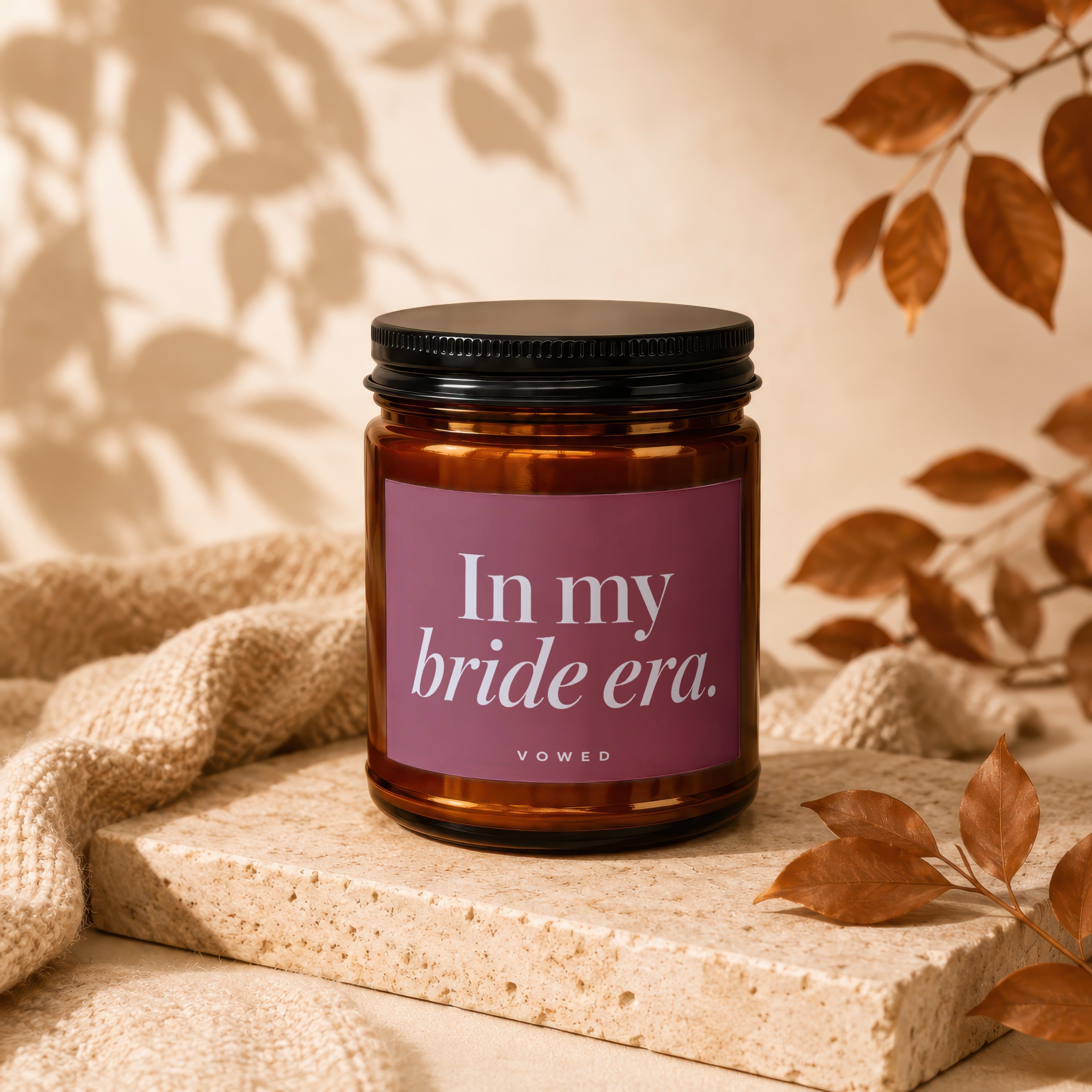 Brown glass candle with "In my bride era." text on a mauve label.
