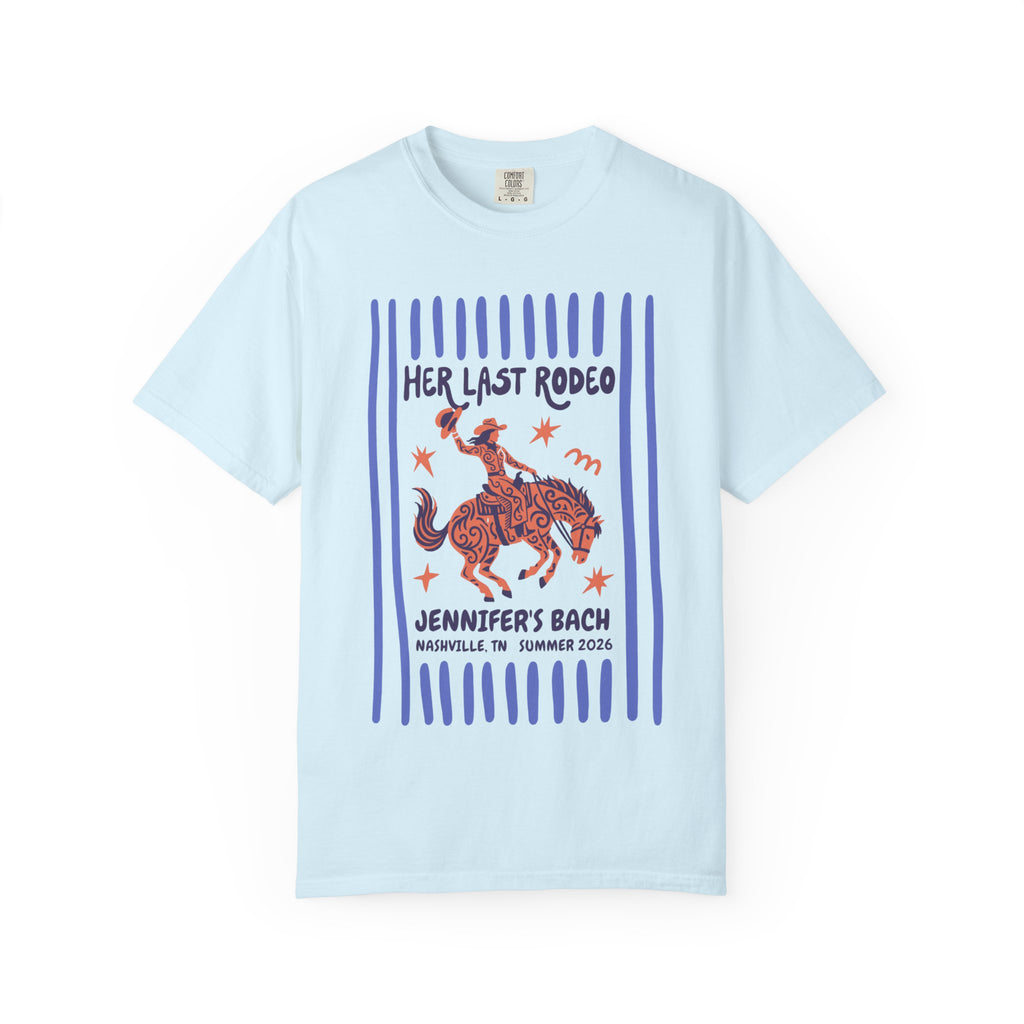 Light blue t-shirt with "Her Last Rodeo" text and a cowgirl graphic.