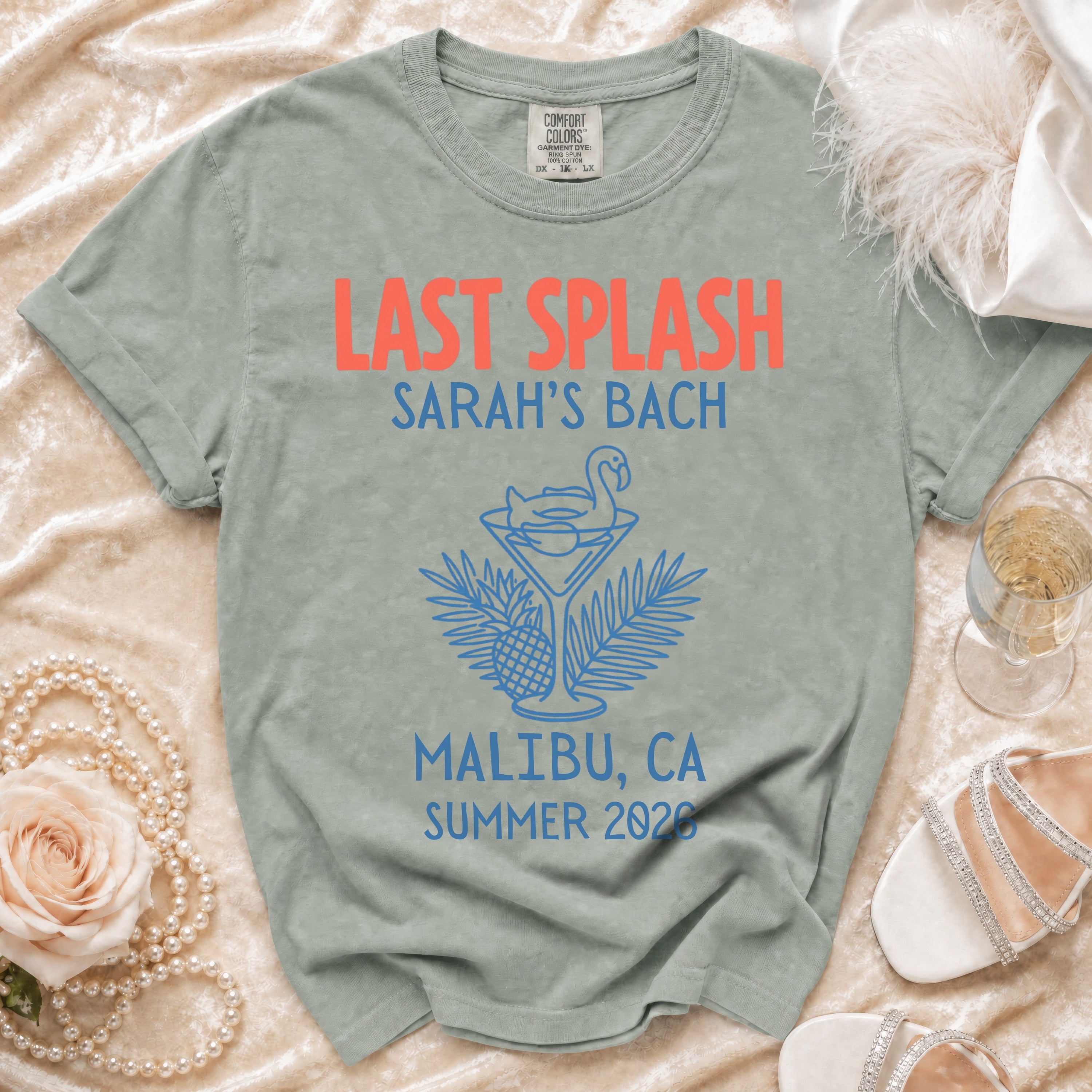 Coral "Last Splash Sarah's Bach Malibu, CA Summer 2026" graphic on grey t-shirt.