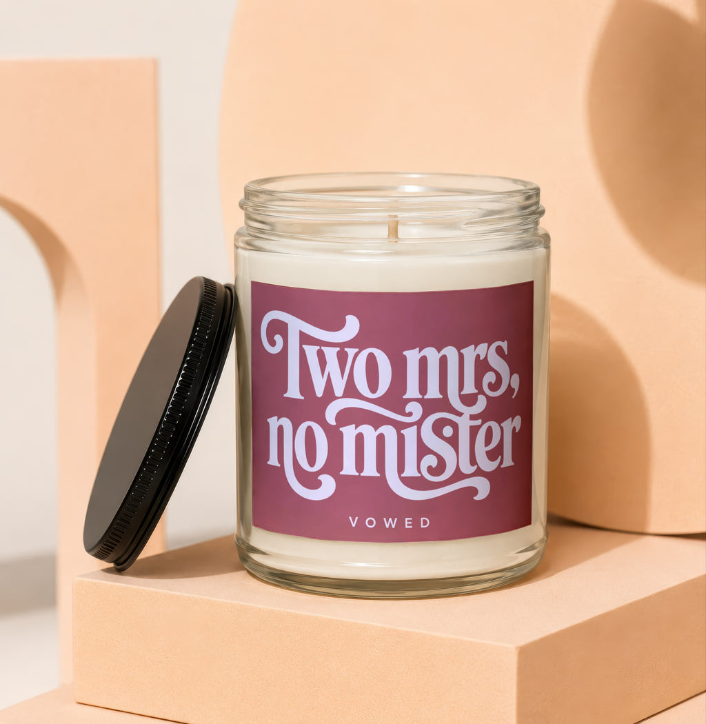 Glass candle with "Two Mrs, no mister" text and "vowed" centered below.