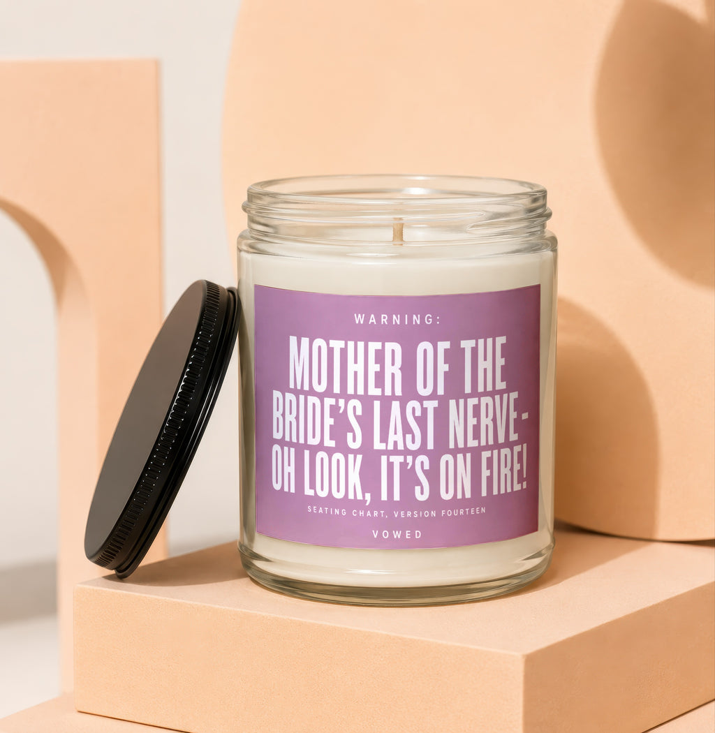 Candle with "Mother of the Bride's Last Nerve" text and black lid.