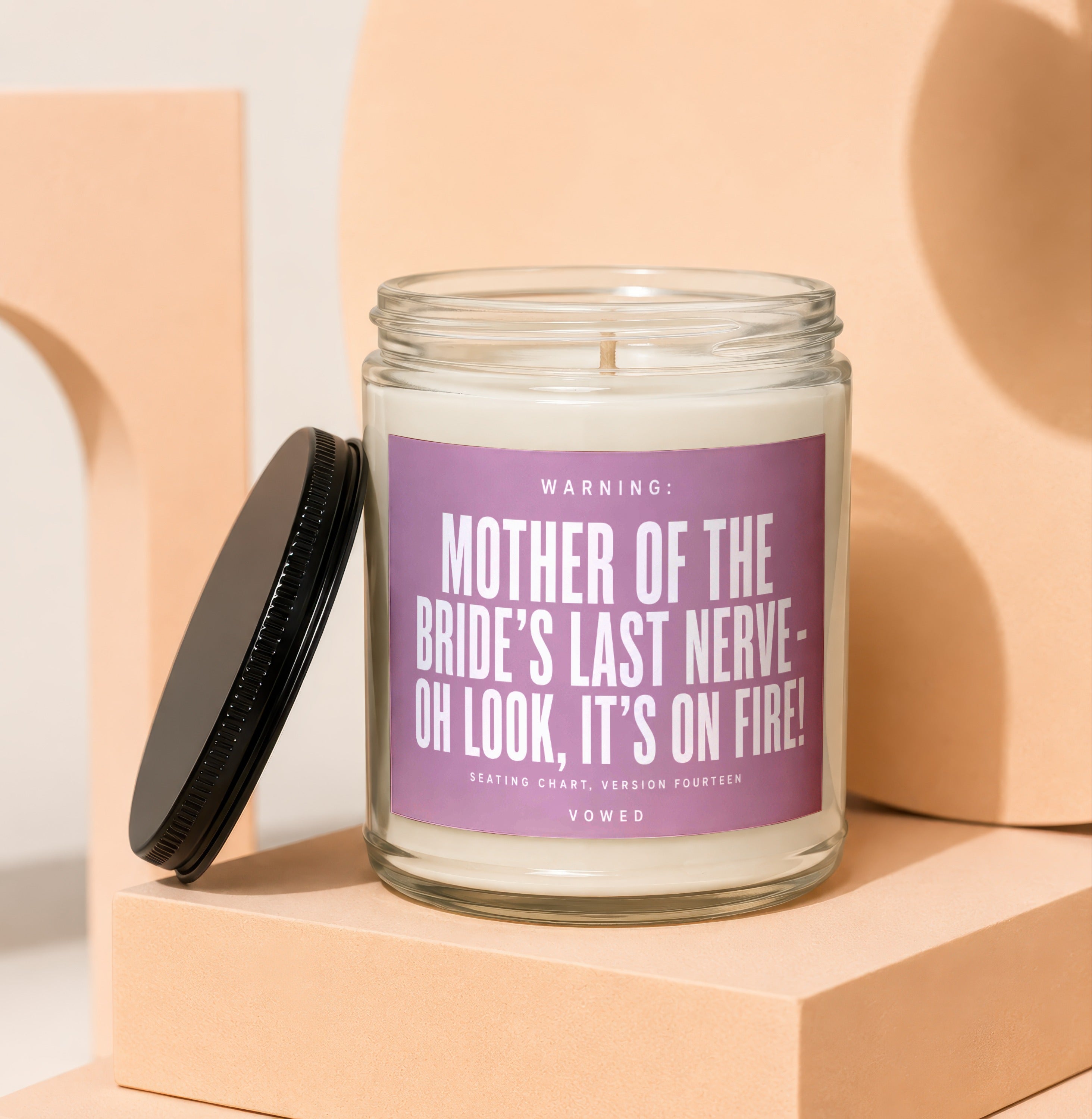 Candle with "Mother of the Bride's Last Nerve" text and black lid.