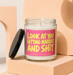 Glass candle with pink label saying "LOOK AT YOU GETTING MARRIED AND SHIT"