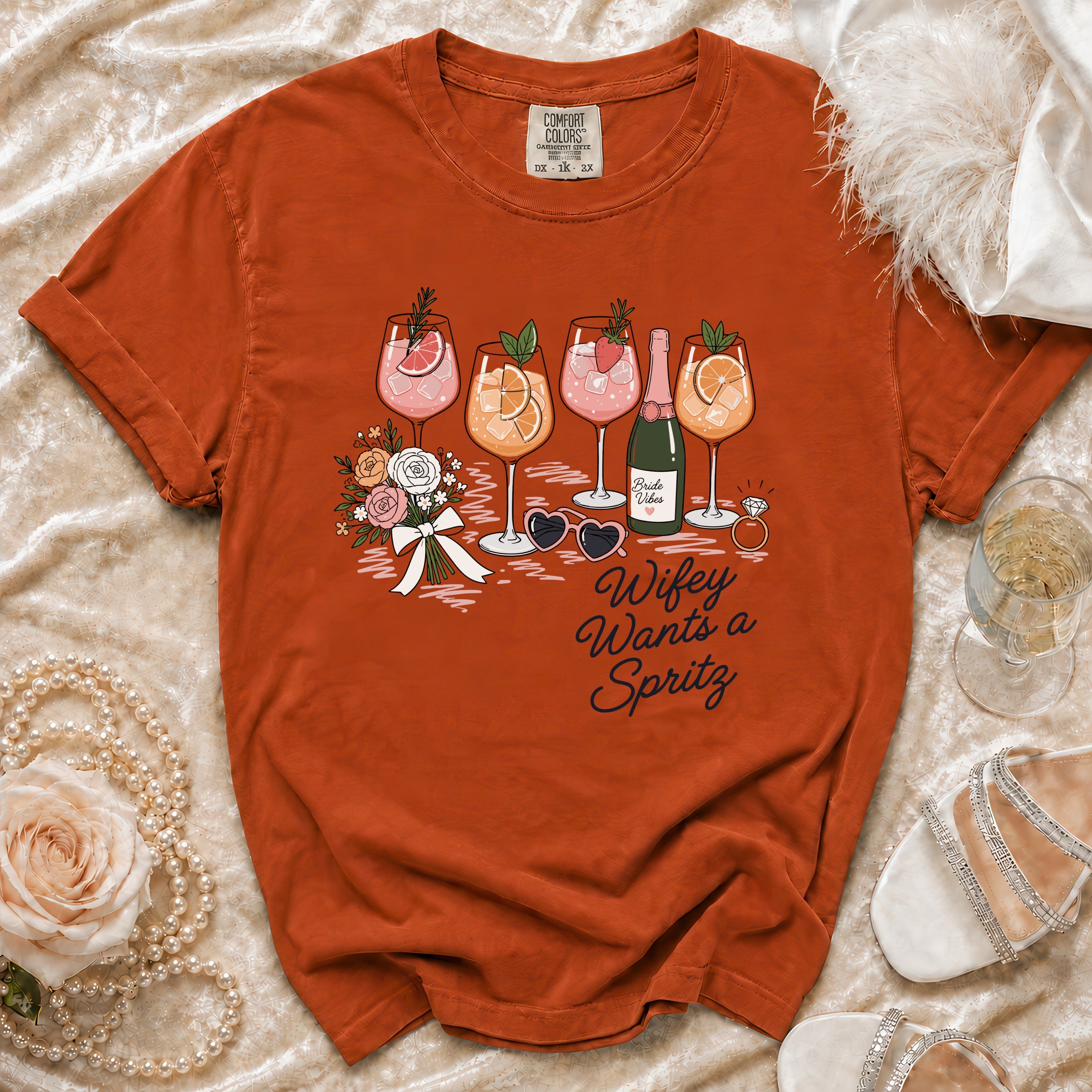 Orange t-shirt with "Wifey Wants a Spritz" and drinks graphic.