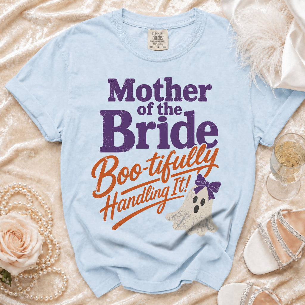 Light blue t-shirt with "Mother of the Bride Boo-tifully Handling It!" text.