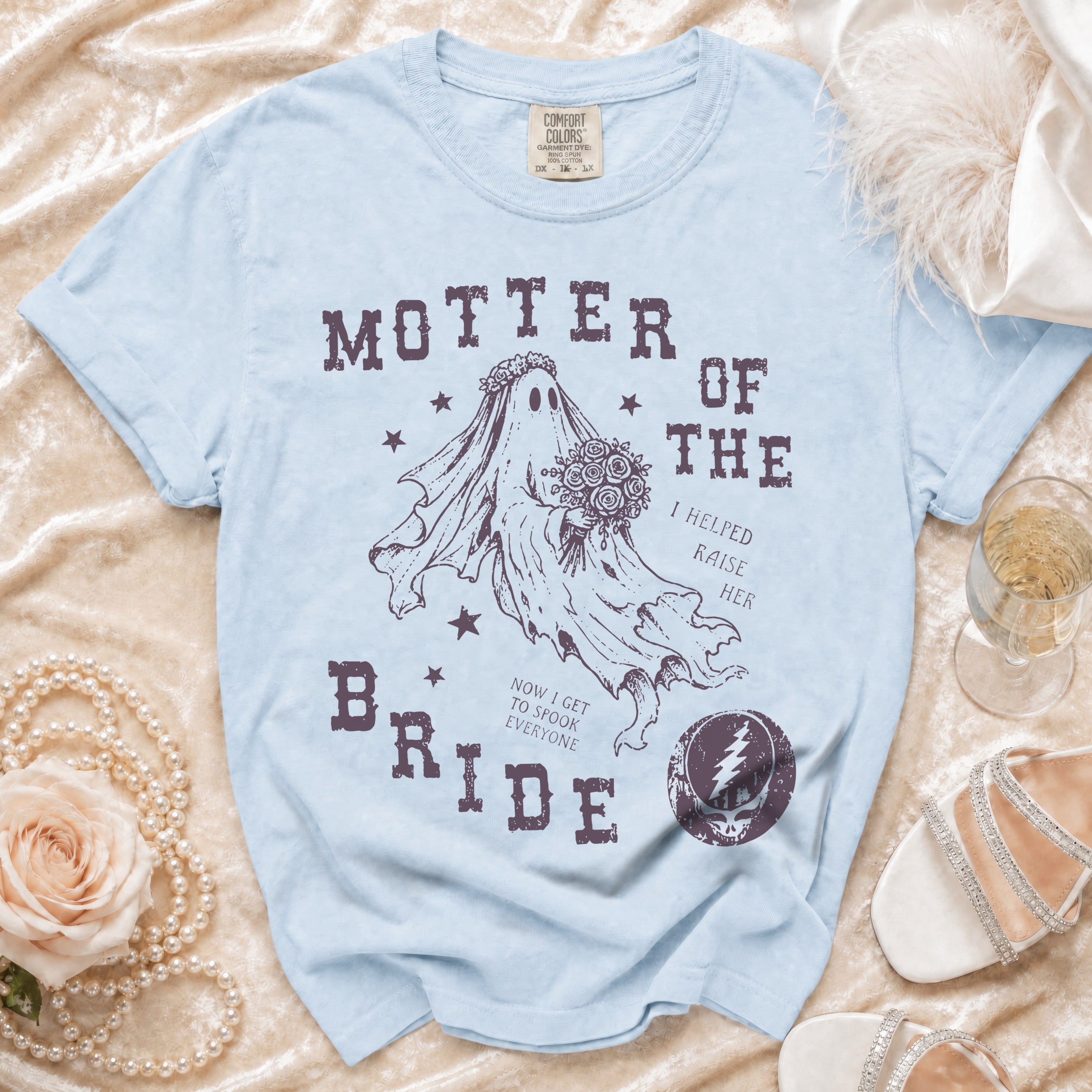 Light blue t-shirt with "MOTHER OF THE BRIDE" text and ghost bride graphic.