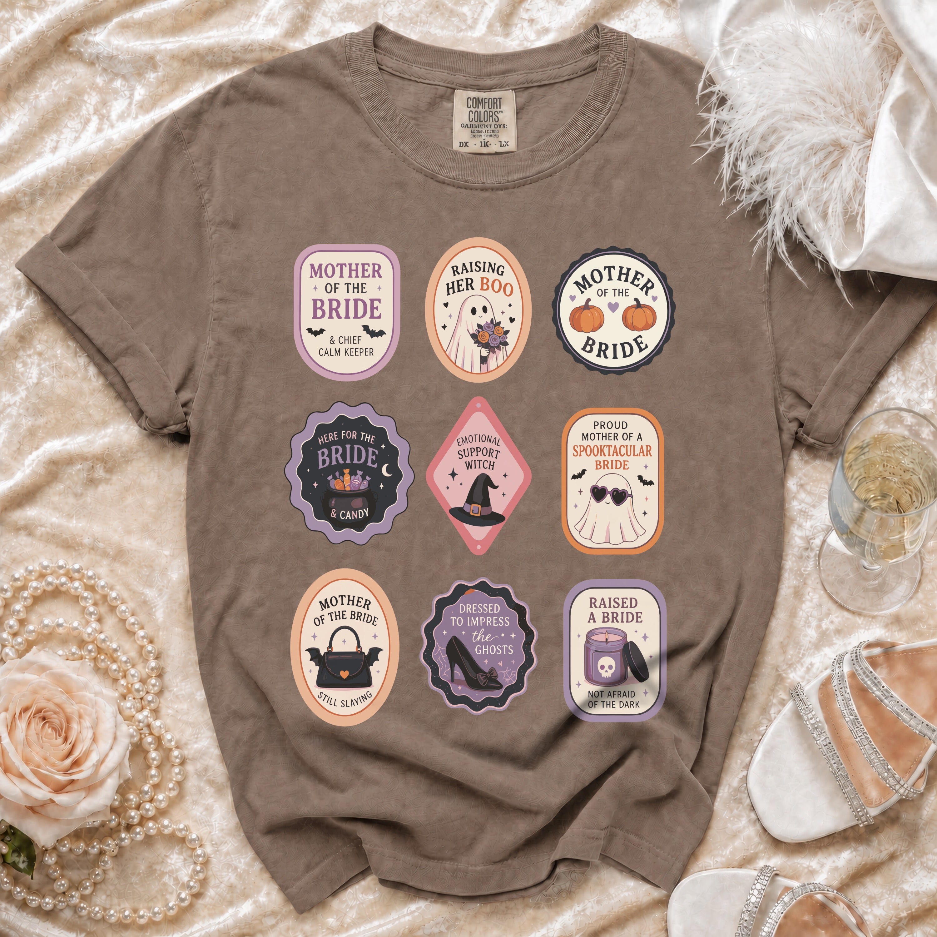 Brown t-shirt with nine Halloween-themed wedding patches featuring ghosts, pumpkins, and bridal elements.