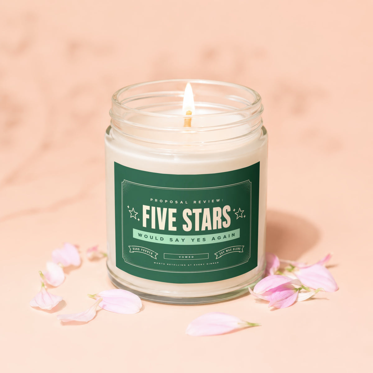 Candle with "Five Stars Would Say Yes Again" text on a green label.