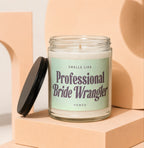 Glass jar candle with label reading "Smells Like Professional Bride Wrangler Vowed."