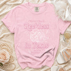 Pink t-shirt with "Olivia's Bach Reckless in Texas Austin, TX Summer 2026" graphic.