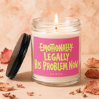 Burning candle with pink label that reads "Emotionally Legally His Problem Now".