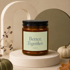 Amber candle in glass jar with black lid, text Better, Together. Vowed.