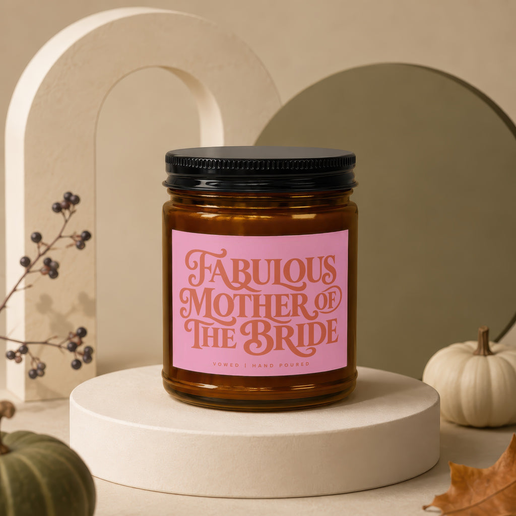 Brown glass candle with pink label reading "Fabulous Mother of The Bride"