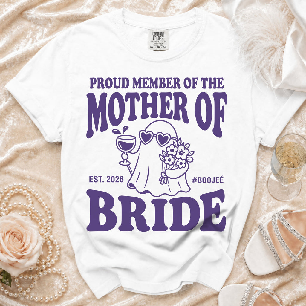 White t-shirt with purple text reading "Proud Member of the Mother of Bride Est. 2026 #Boojeé".