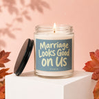 Candle with text "Marriage Looks Good on Us" by VOWED.