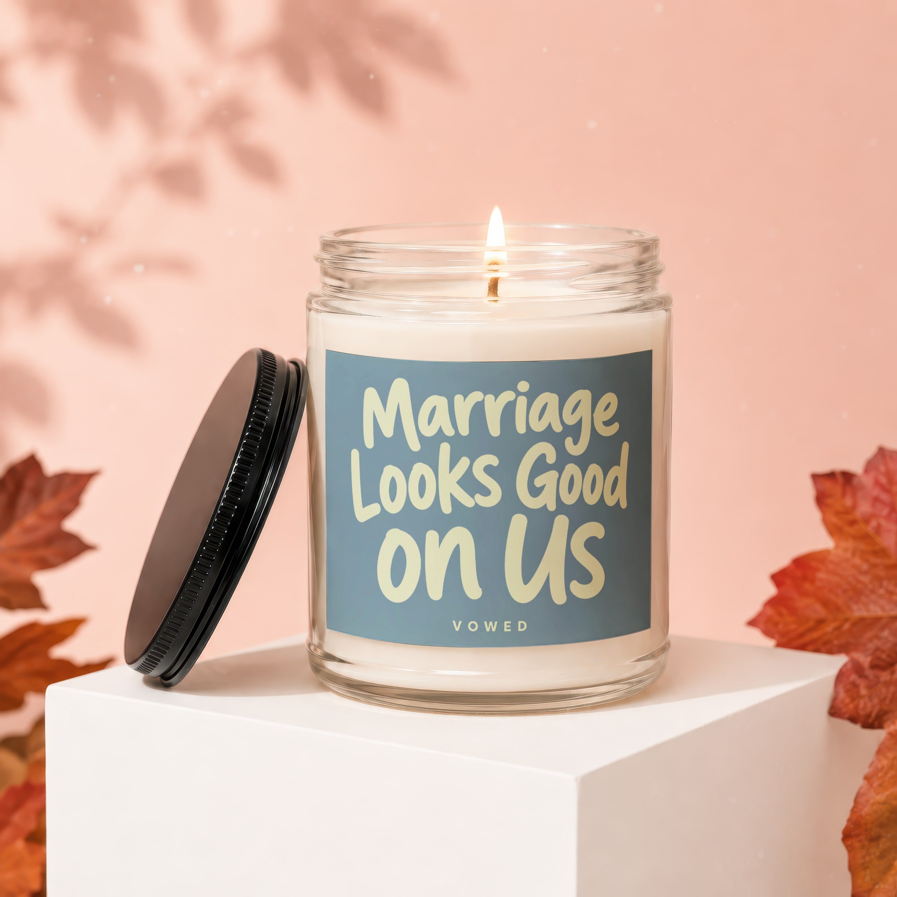 Candle with text "Marriage Looks Good on Us" by VOWED.
