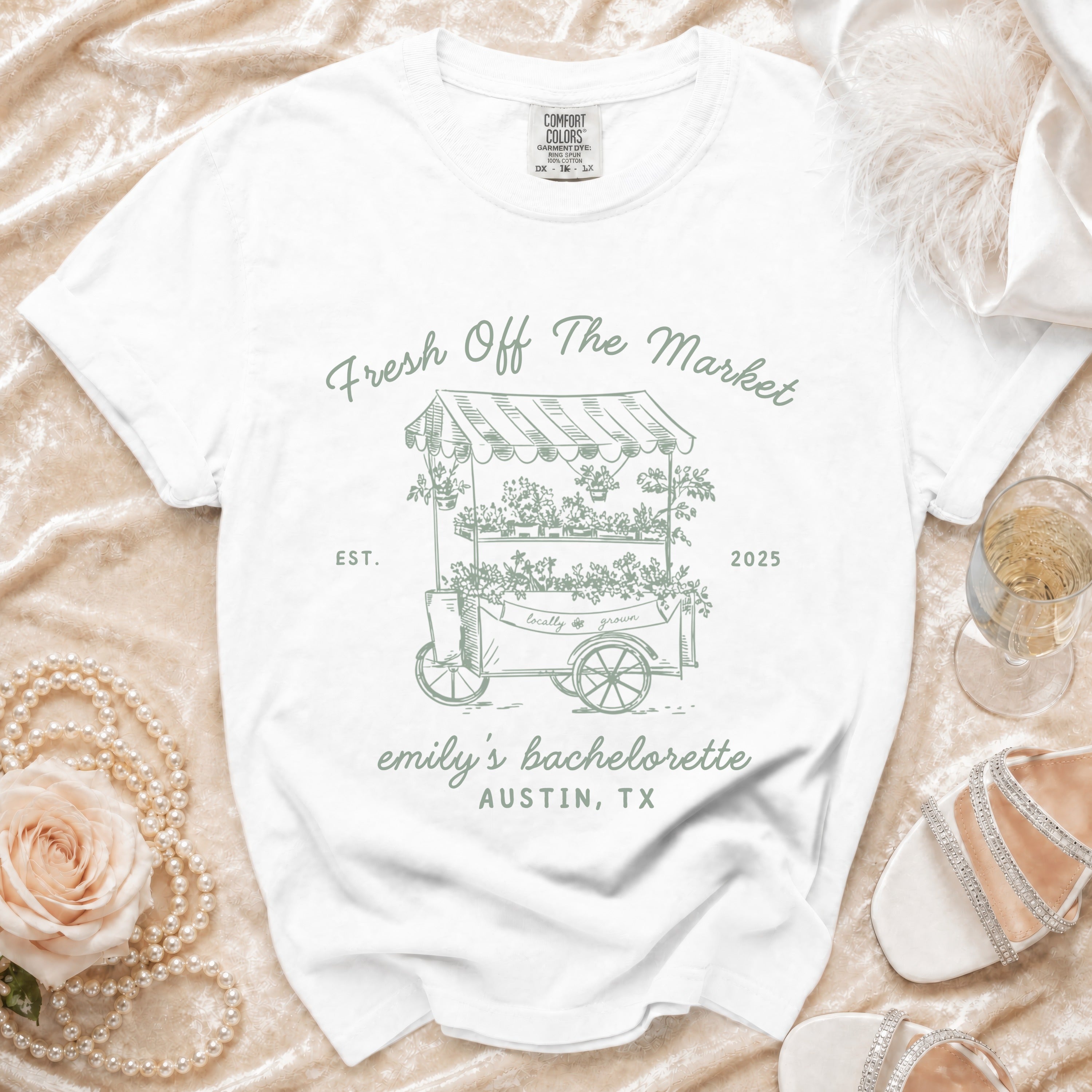 White t-shirt with "Fresh Off The Market" and "emily's bachelorette Austin, TX" text.