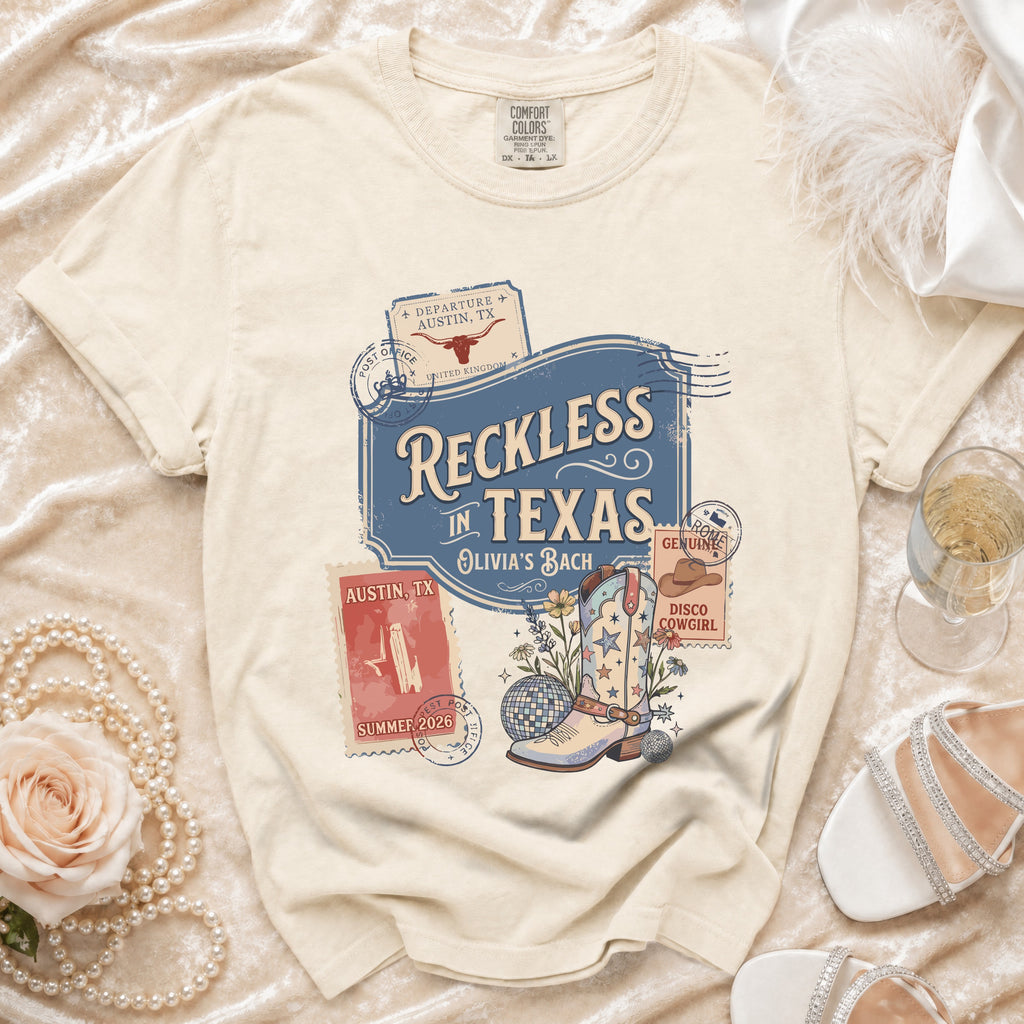 Cream t-shirt with "Reckless in Texas" and disco boot graphic.