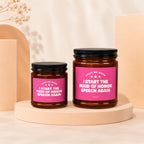 Two candles with pink labels reading "Light Me When I Start The Maid of Honor Speech Again".