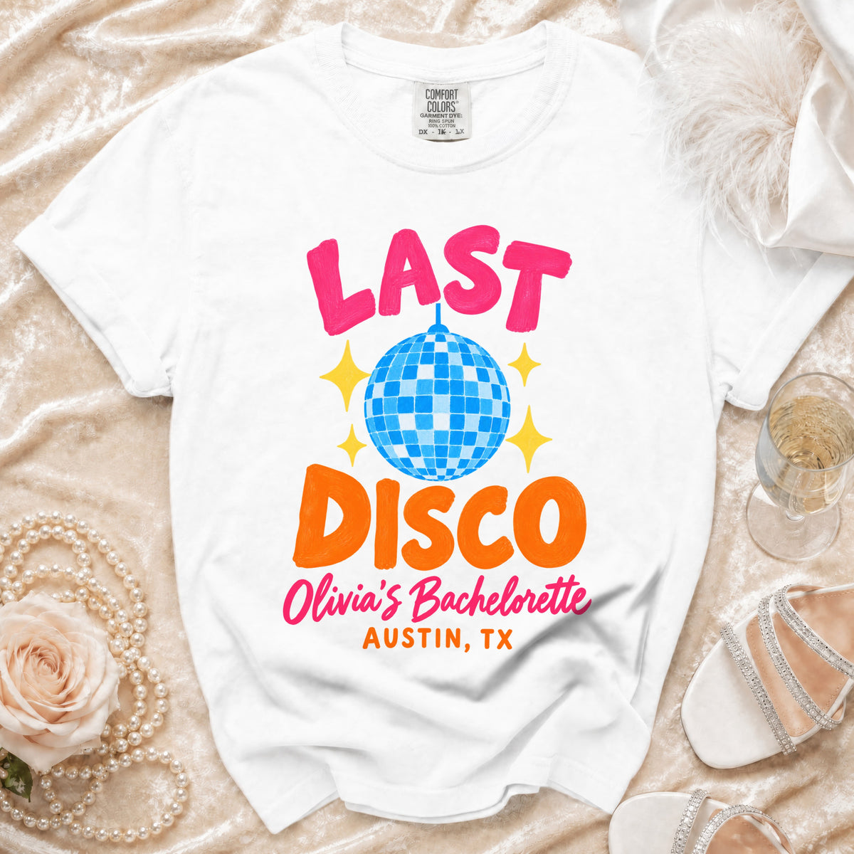 White t-shirt with "Last Disco," "Olivia's Bachelorette," and "Austin, TX" graphics.