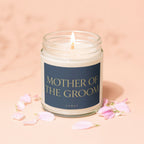 Candle with text "Mother of the Groom" and "Vowed" written on label.