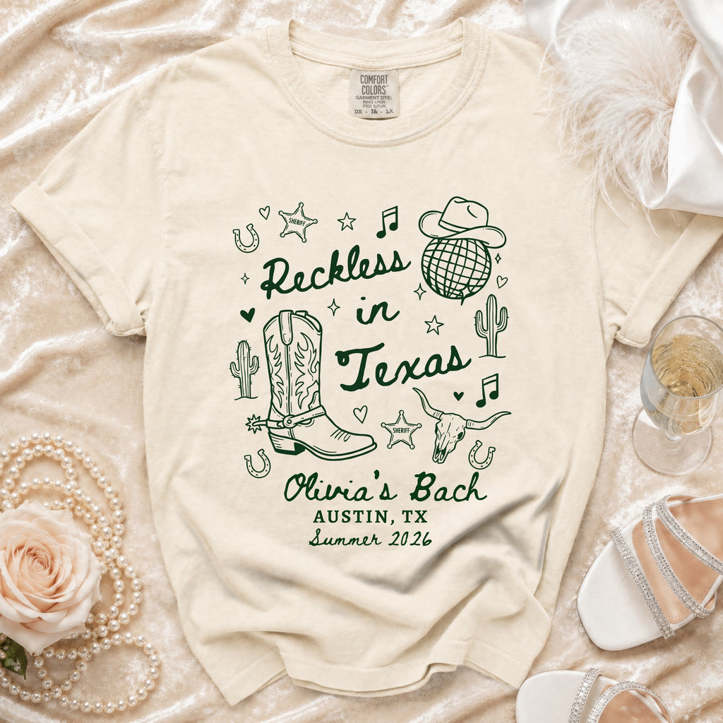 T-shirt with "Reckless in Texas" and cowboy boot graphic, Austin, TX Summer 2026.