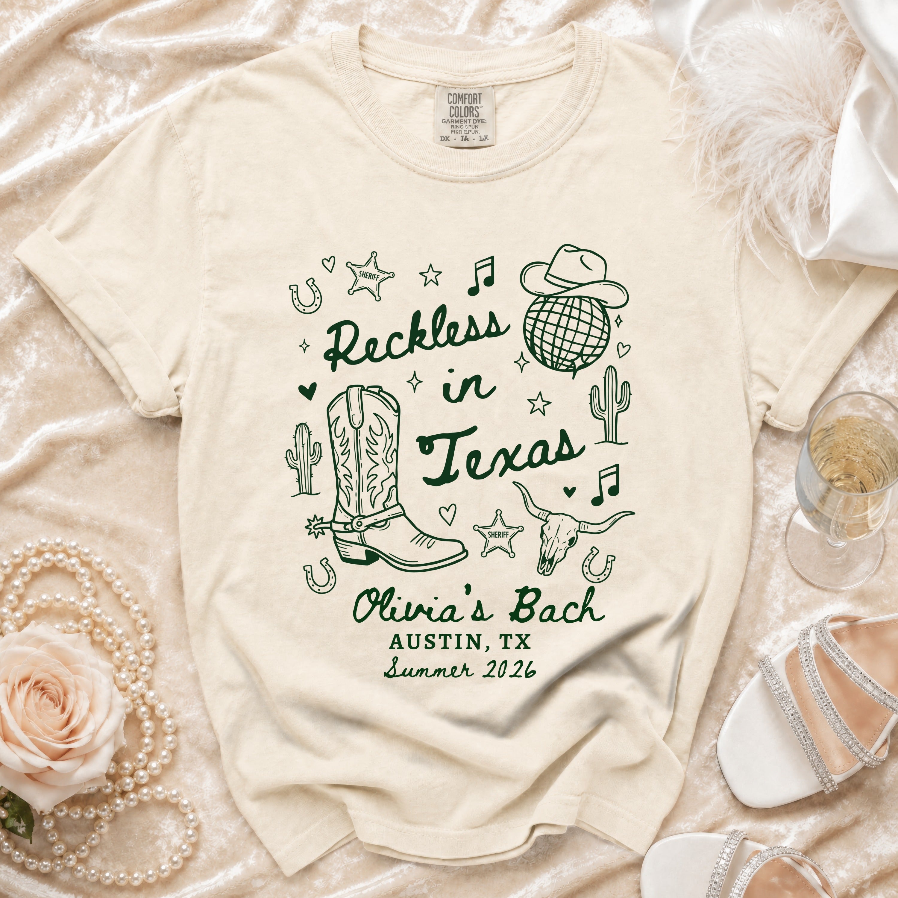 T-shirt with "Reckless in Texas" and cowboy boot graphic, Austin, TX Summer 2026.