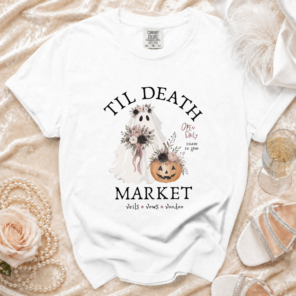 White t-shirt with "Til Death Market" graphic featuring a ghost bride and pumpkin.