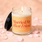 Glass candle with lit flame and label reading "Married My Best Friend".