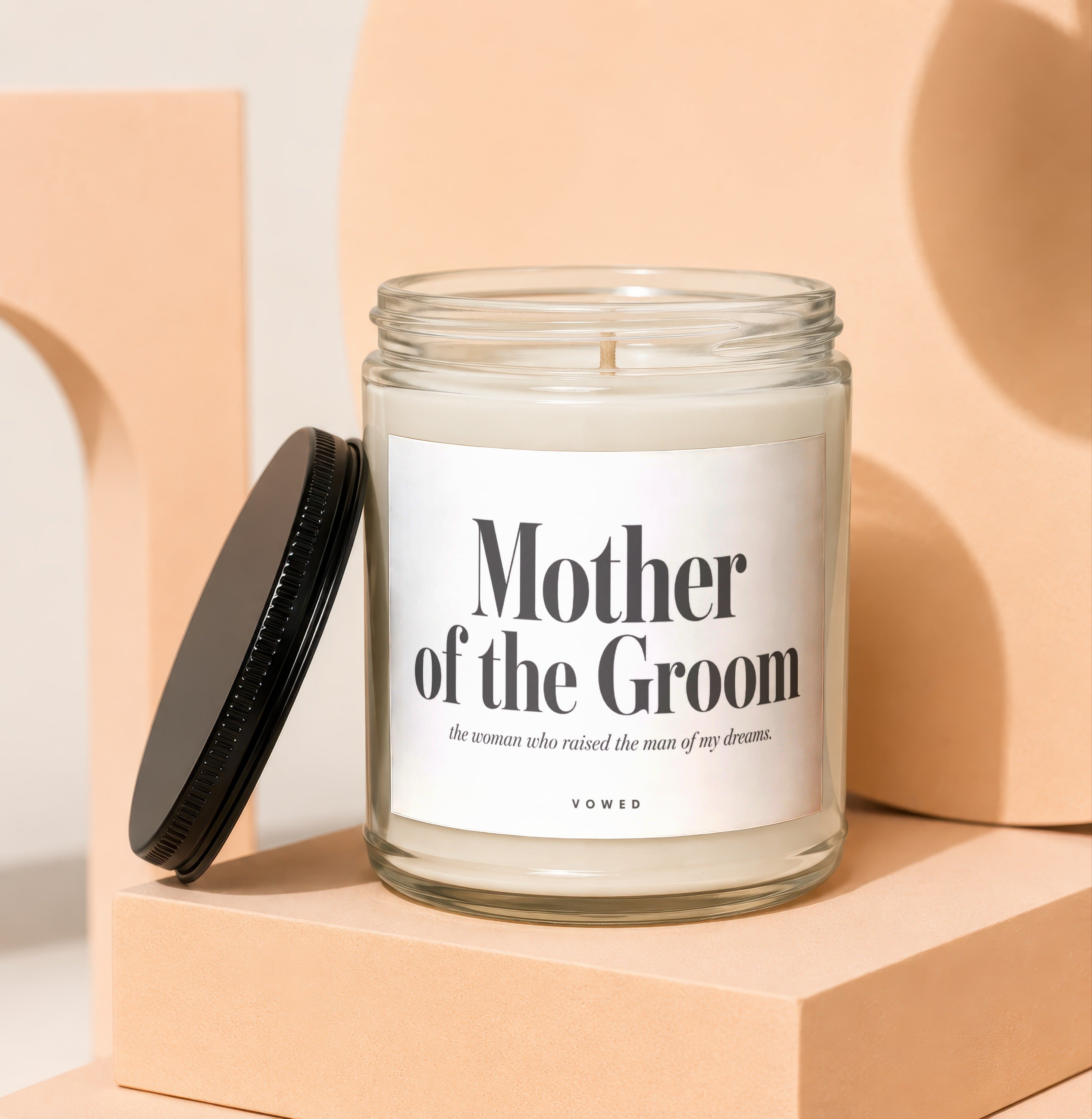 A glass jar candle with "Mother of the Groom" and a quote.
