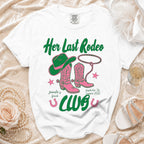 White t-shirt with pink cowboy boots and hat, "Her Last Rodeo" text.