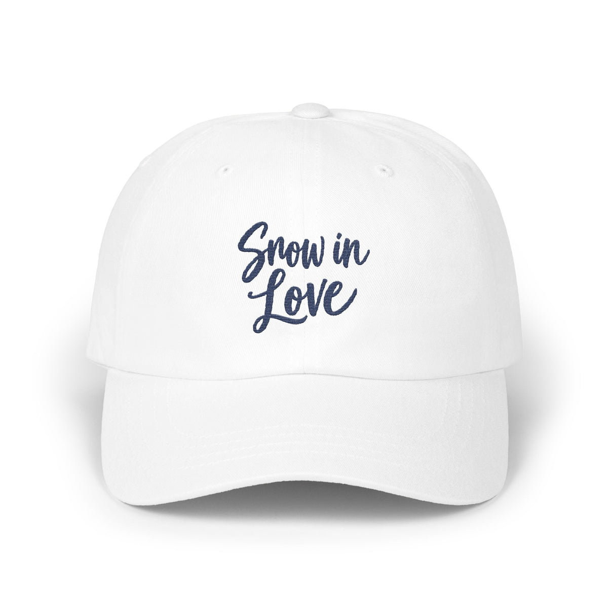 A white baseball cap with the blue embroidered text Snow in Love on the front.