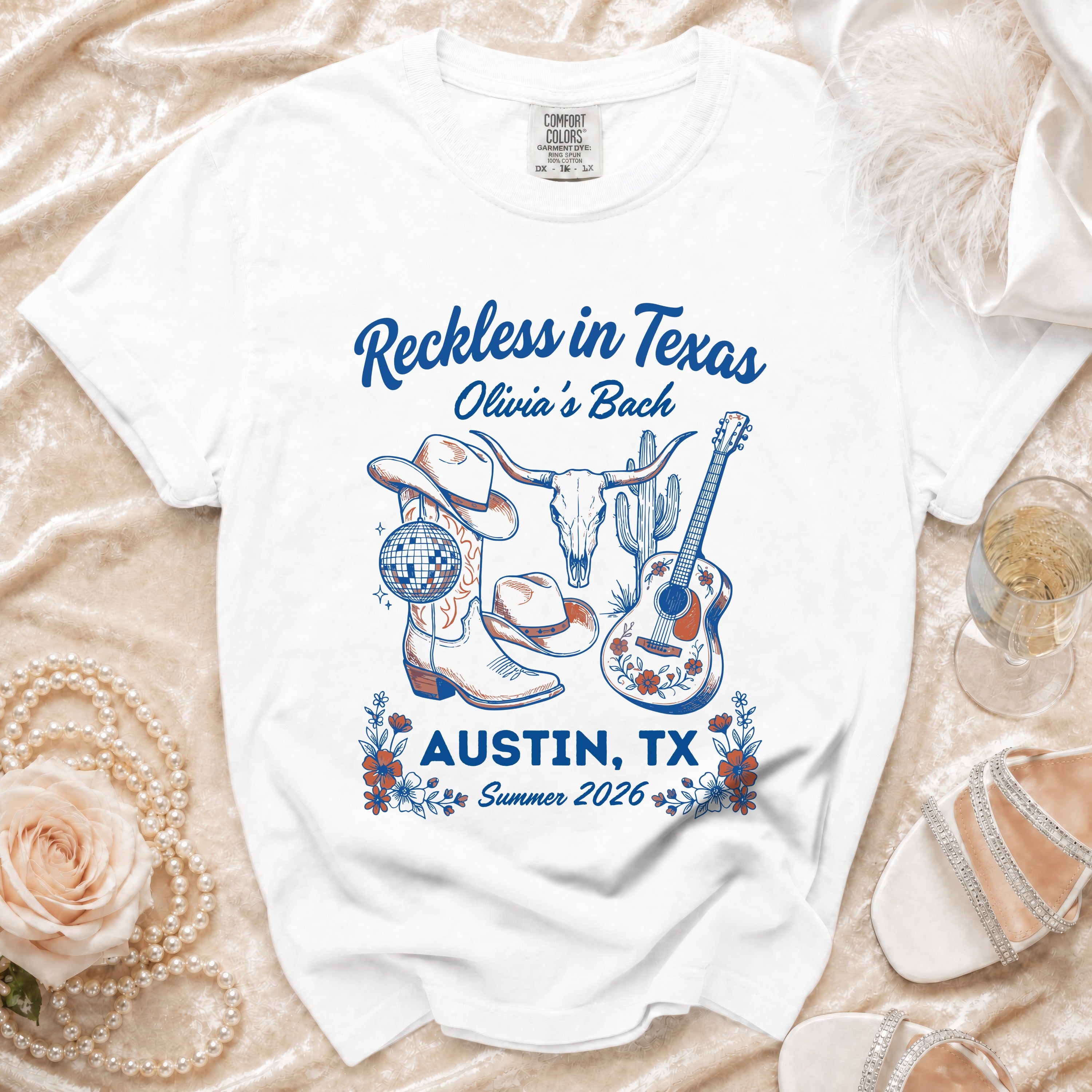 White t-shirt with "Reckless in Texas" and Austin graphics.