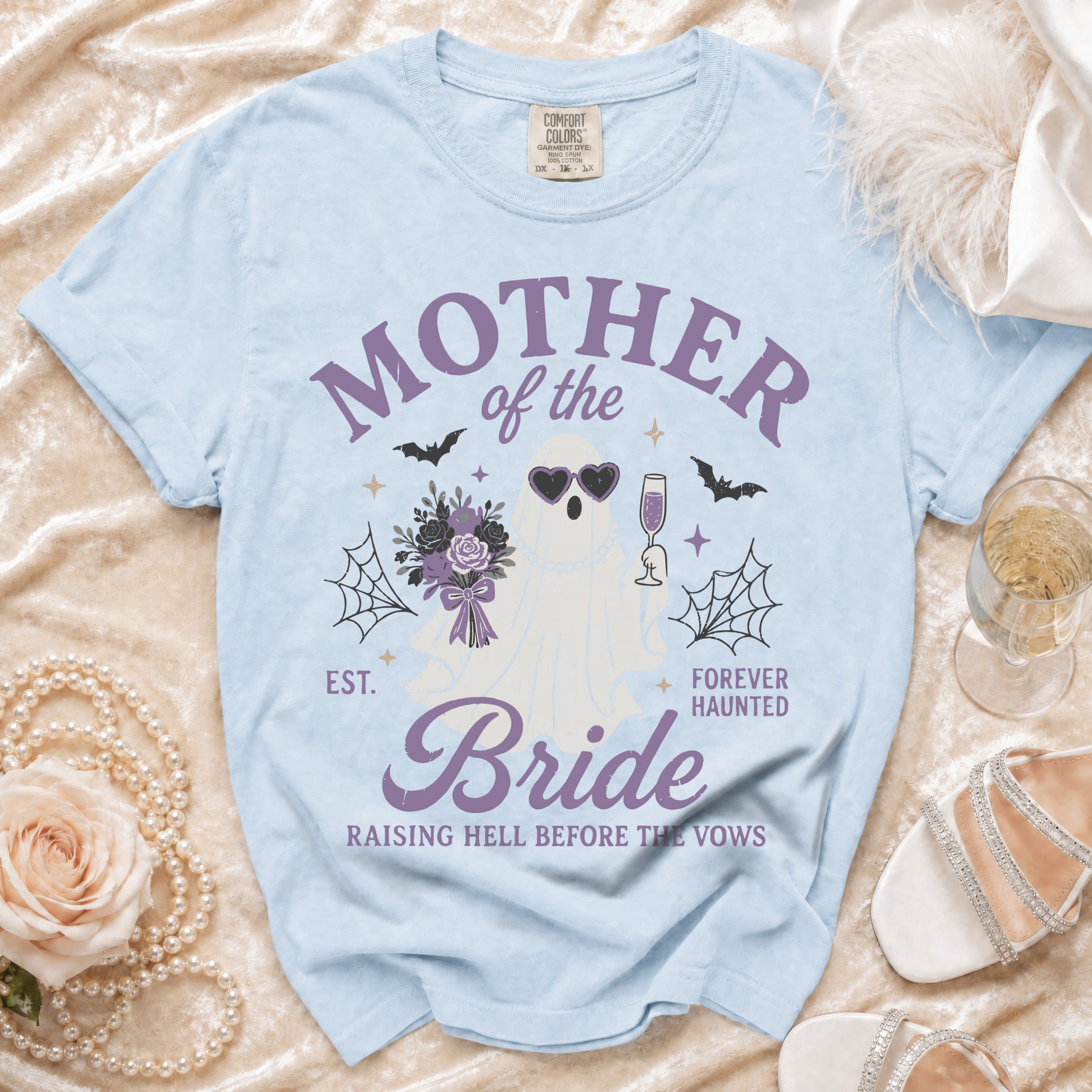 Light blue t-shirt with "Mother of the Bride" graphic and ghost design.