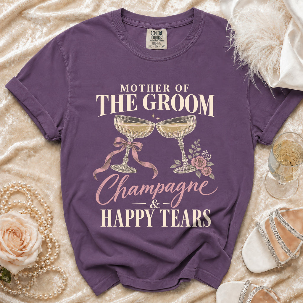 Purple t-shirt with "Mother of the Groom Champagne & Happy Tears" text and champagne glasses.