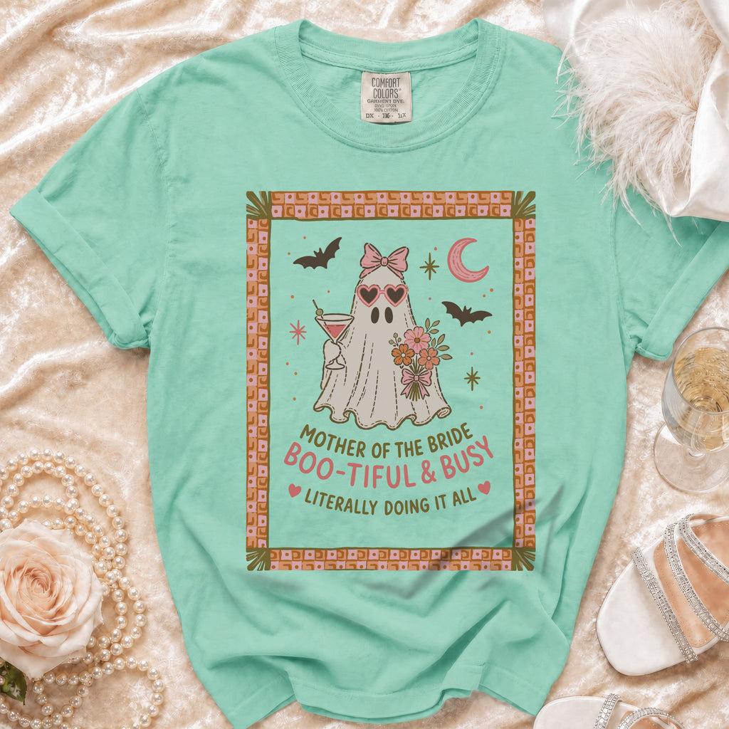 Mint green t-shirt with a ghost graphic that reads "Mother of the Bride Boo-tiful & Busy".