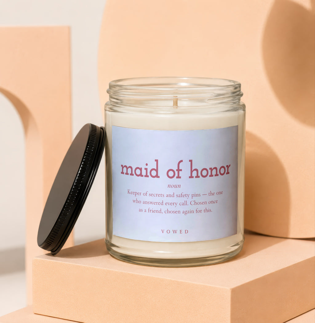 Maid of Honor candle with definition text and black lid.