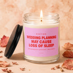 Candle with text "Wedding planning may cause loss of sleep" and "Vowed".
