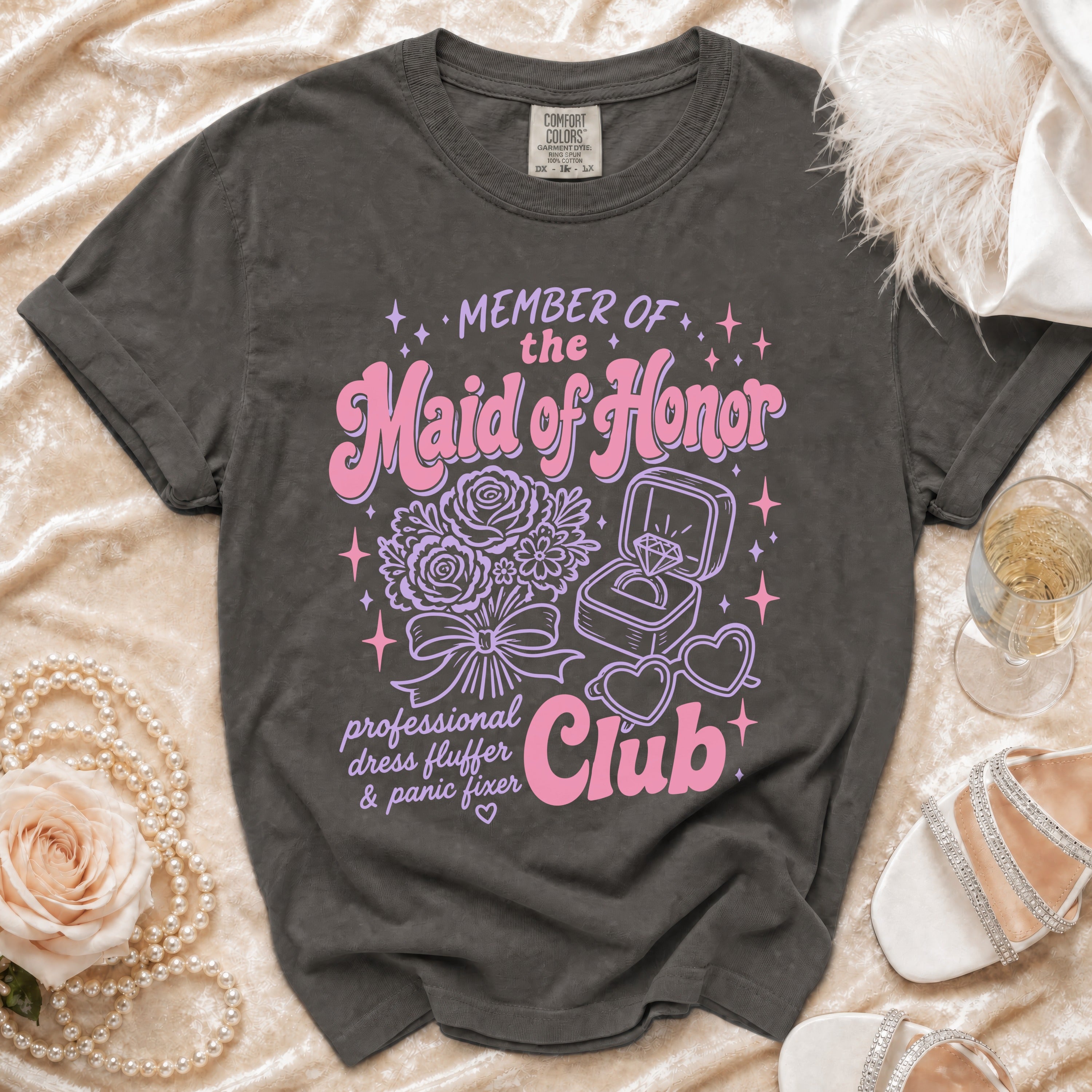 T-shirt with "Member of the Maid of Honor Club" graphic and bridal accessories.