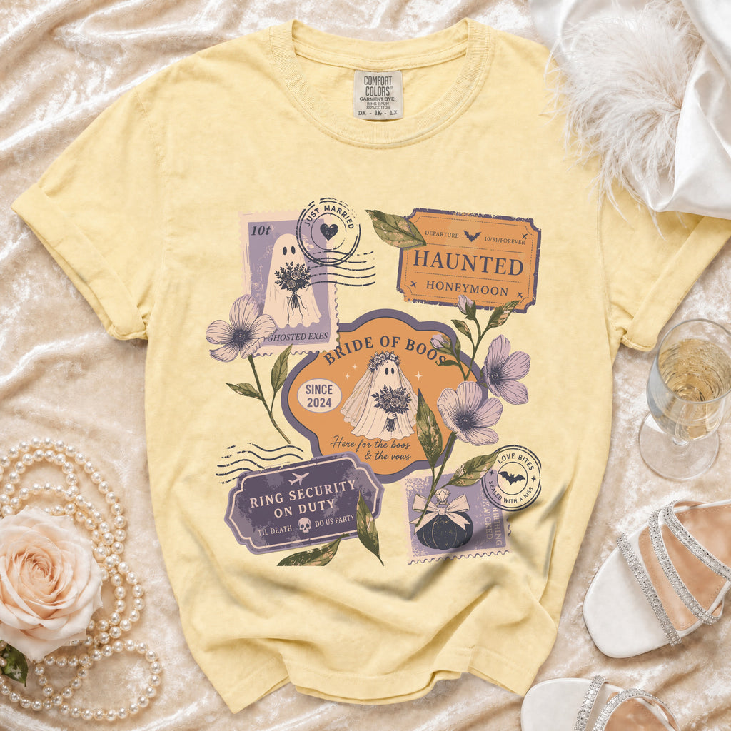 Yellow t-shirt with "Bride of Boos" graphic featuring ghosts and wedding-themed stamps.