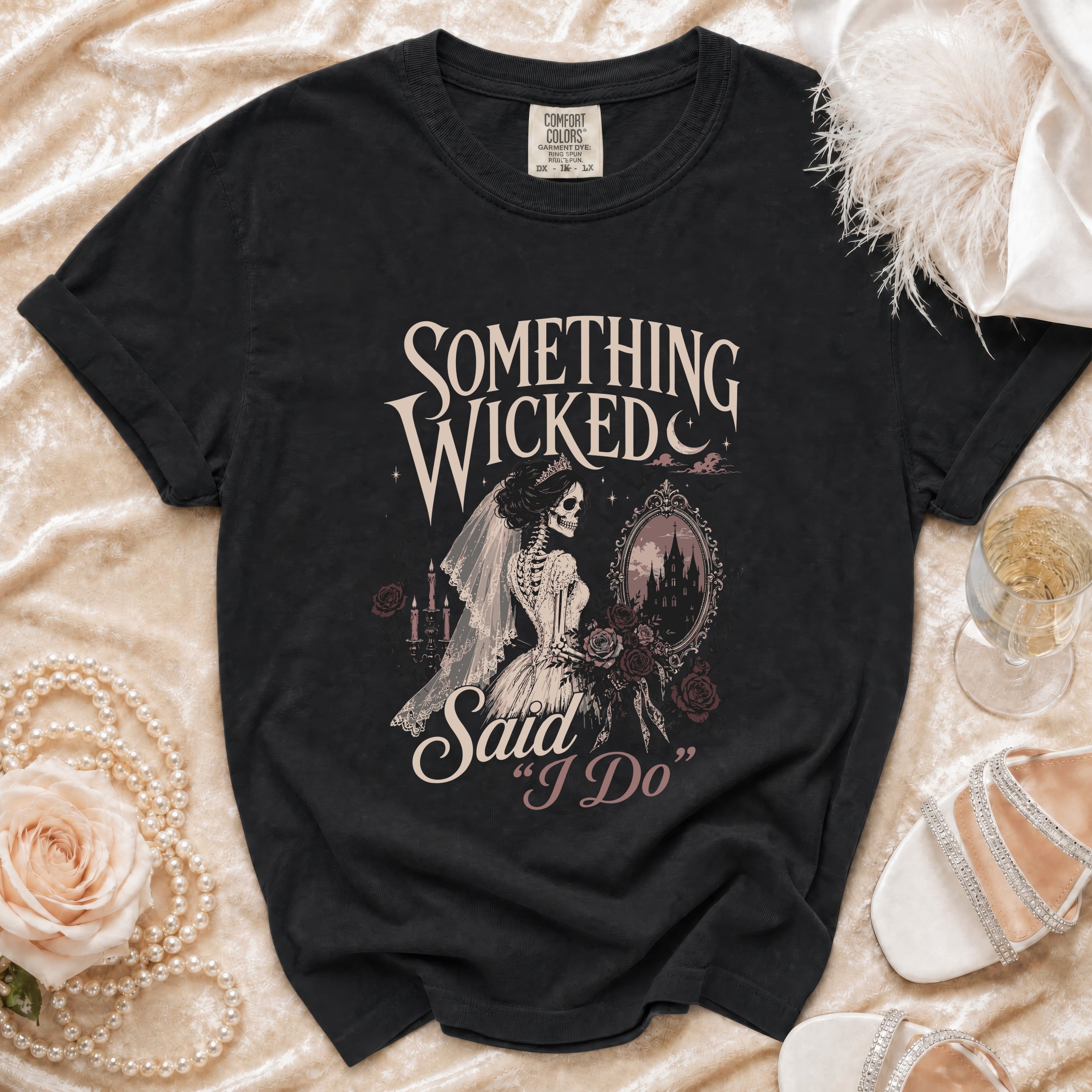 Black t-shirt with "Something Wicked Said I Do" skeleton bride graphic.