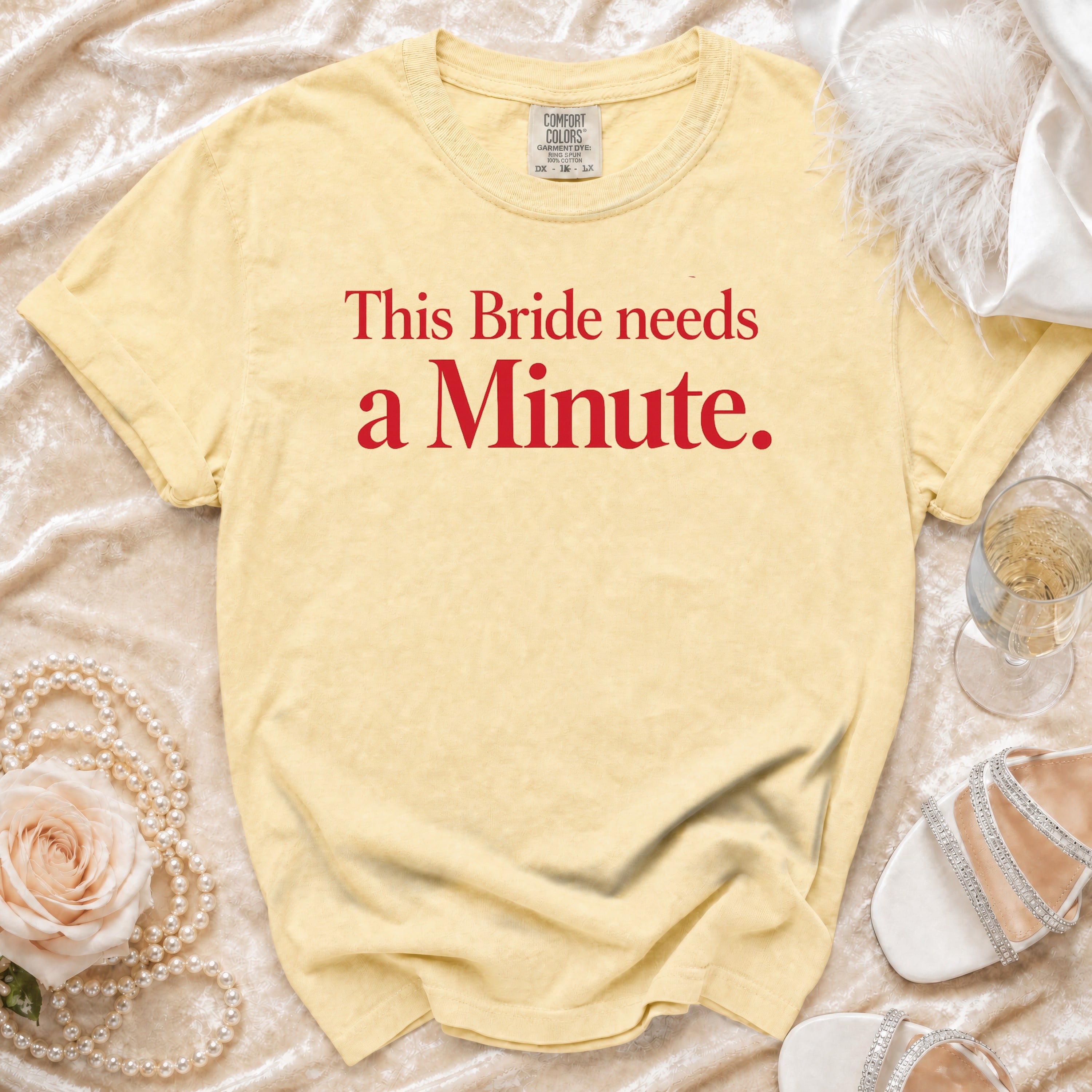 Yellow t-shirt with red text "This Bride needs a Minute."