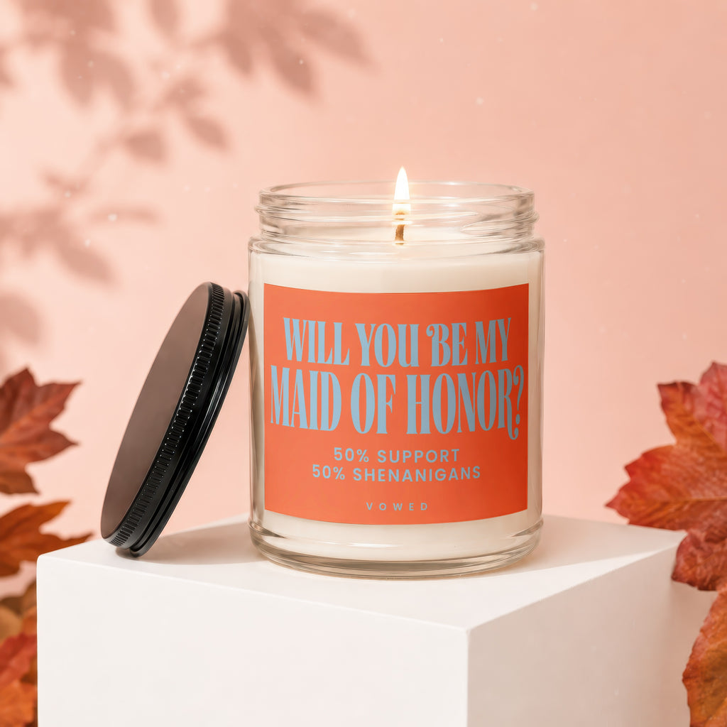 Candle asking "Will You Be My Maid of Honor?" with "50% Support 50% Shenanigans".