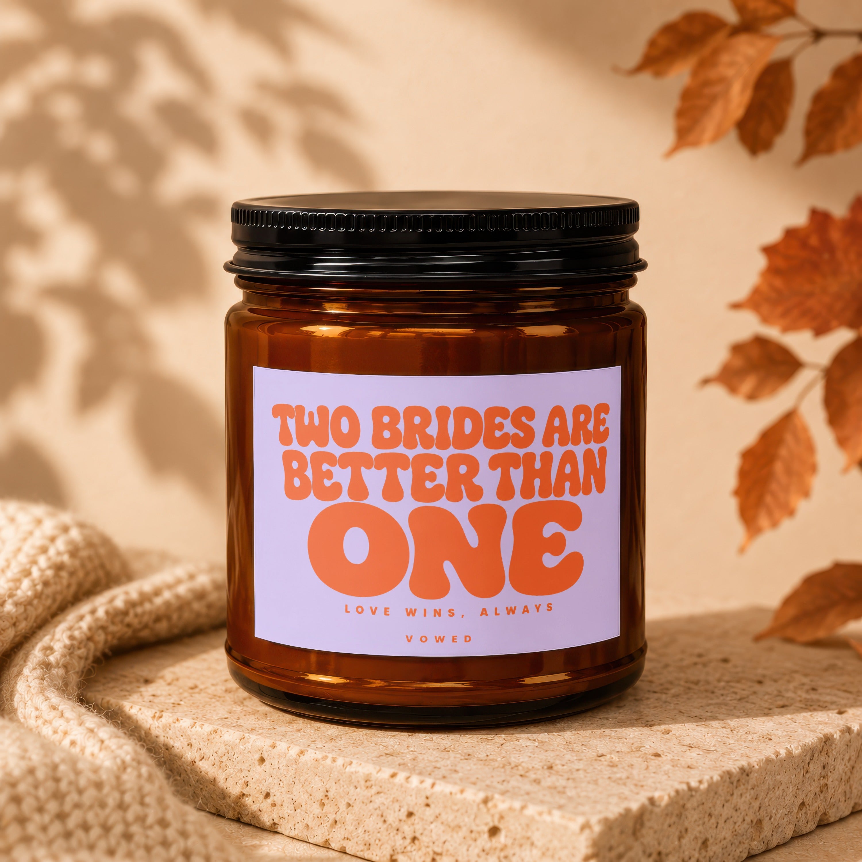 Amber candle with "Two Brides Are Better Than One" text.