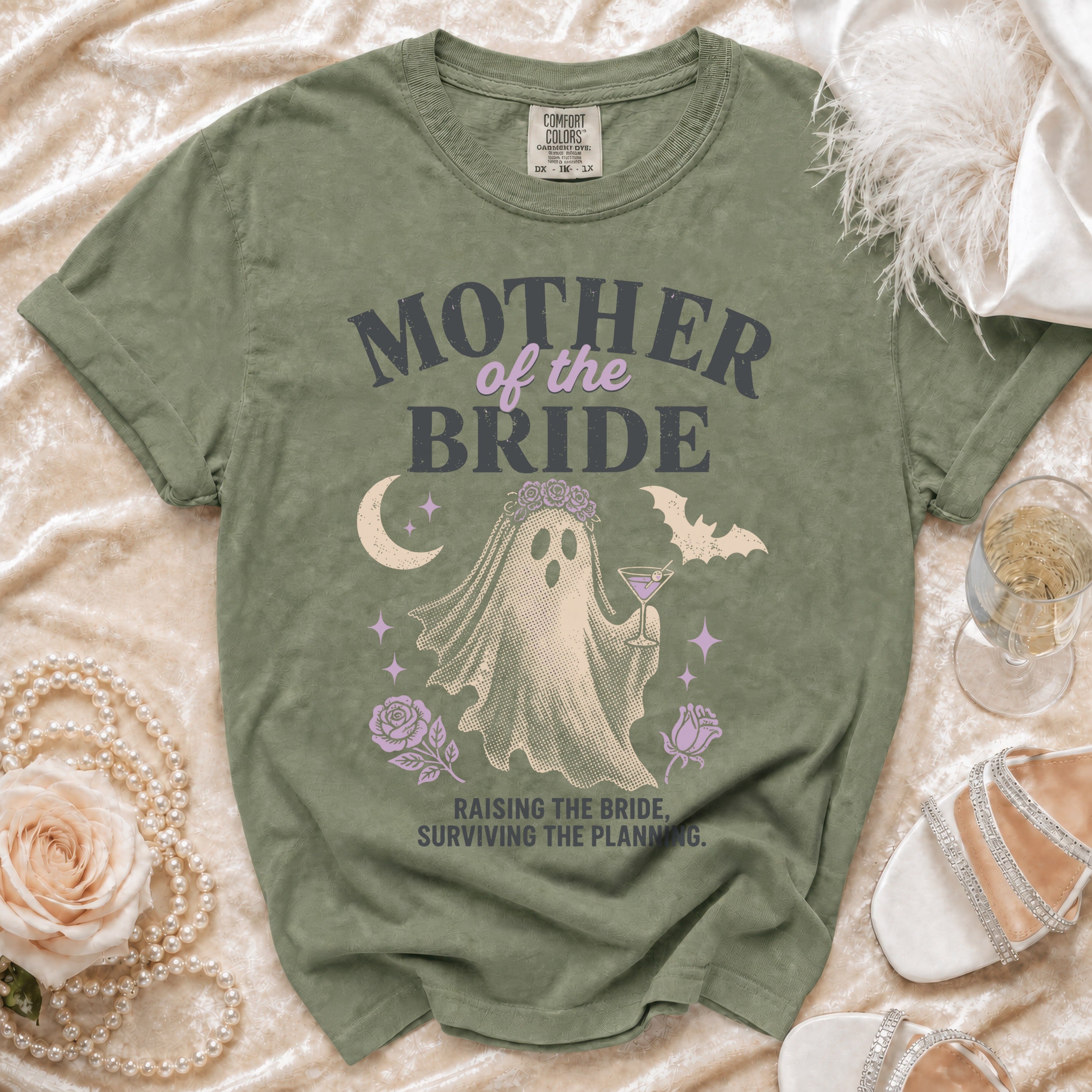 Ghost graphic t-shirt with "Mother of the Bride" text and "Raising the bride, surviving the planning" saying.