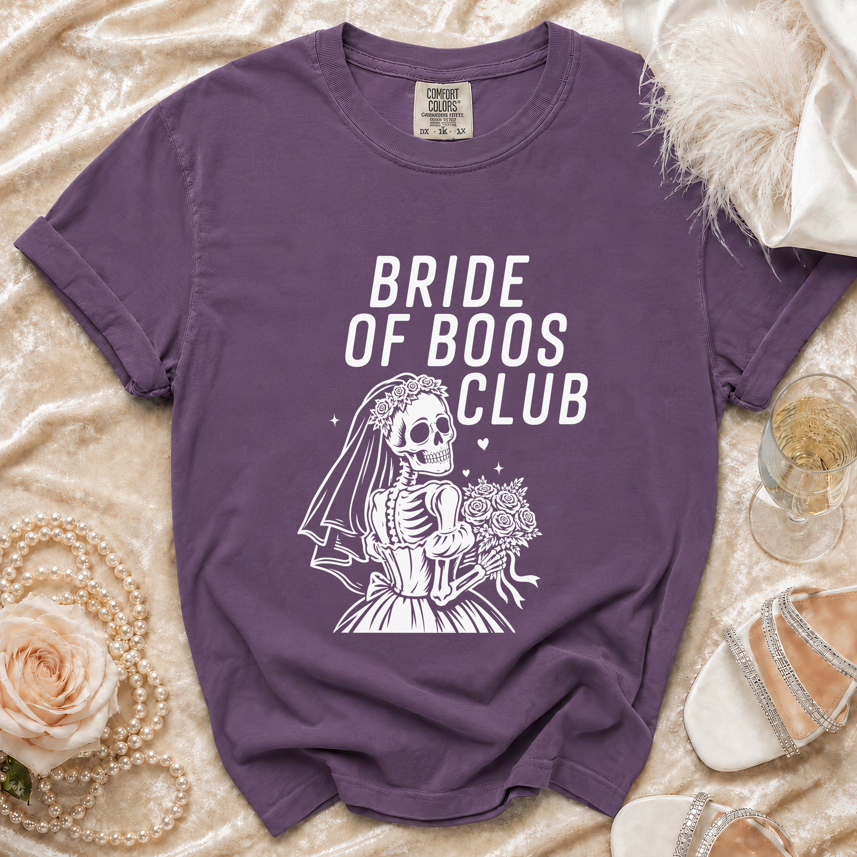 Purple t-shirt with "Bride of Boos Club" text and skeleton bride graphic.