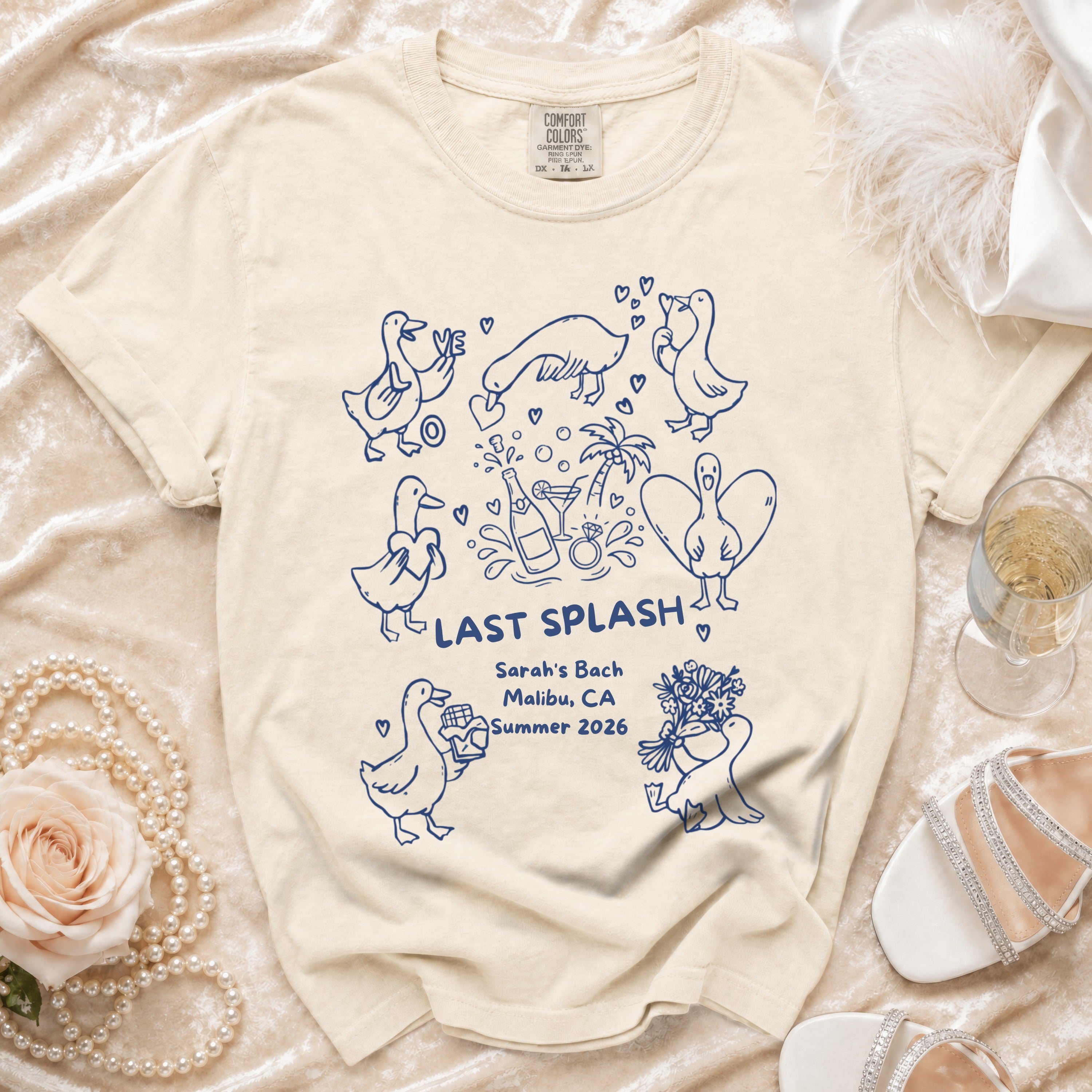 Cream t-shirt with "LAST SPLASH Sarah's Bach Malibu, CA Summer 2026" and duck illustrations.